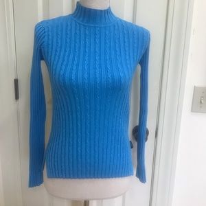 Obermeyer teal ski sweater.